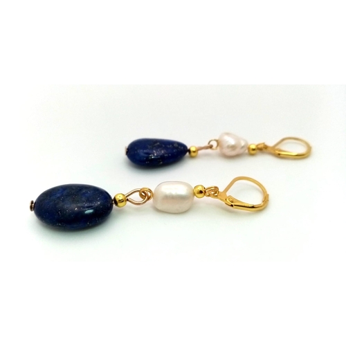940 - A Pair of Lapis Lazuli and Cultured Baroque Pearl Drop Earrings. Gilded clasp. 4cm drop