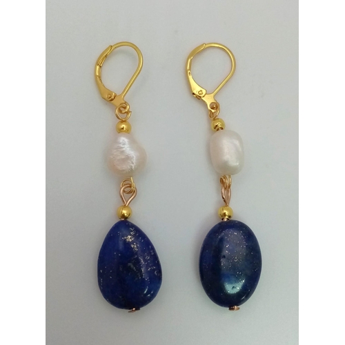 940 - A Pair of Lapis Lazuli and Cultured Baroque Pearl Drop Earrings. Gilded clasp. 4cm drop