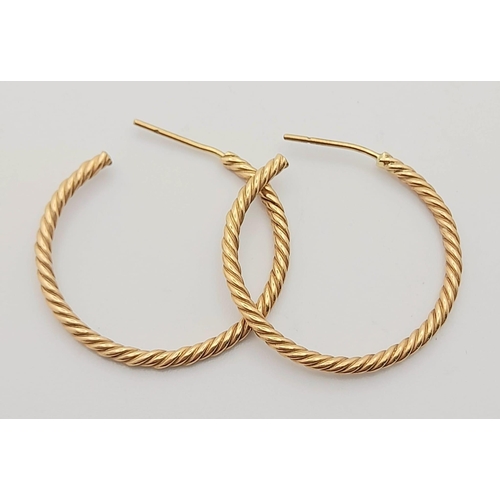 942 - A Pair of 9K Yellow Gold Twist Hoop Earrings. 3.87g