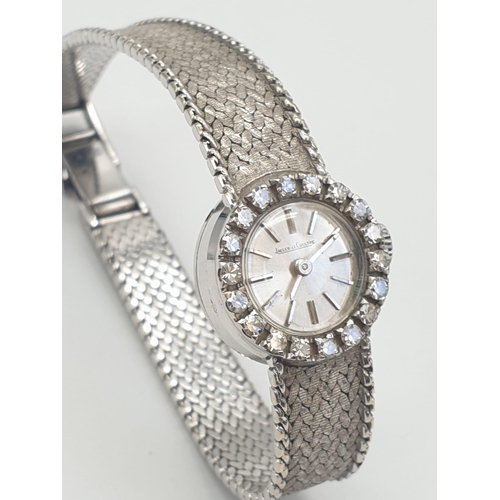 386 - A JAEGER LE COULTRE LADIES 18K WHITE GOLD AND DIAMOND MANUAL WATCH.  18mm