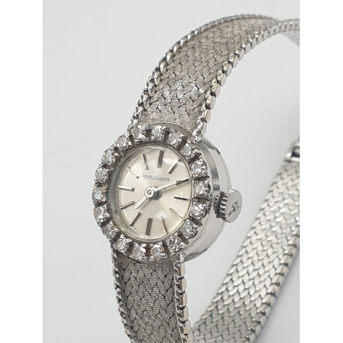 386 - A JAEGER LE COULTRE LADIES 18K WHITE GOLD AND DIAMOND MANUAL WATCH.  18mm