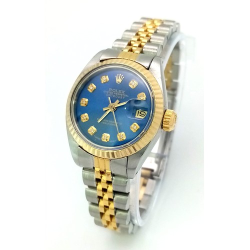 473 - A LADIES ROLEX OYSTER PERPETUAL DATEJUST IN BI-METAL WITH BLUE DIAL AND DIAMOND NUMERALS A VERY ATTR... 