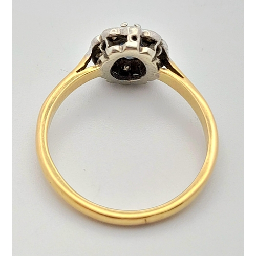 408 - A Vintage 18K Yellow Gold Sapphire and Diamond Ring. Central sapphire with a halo of diamonds. Size ... 