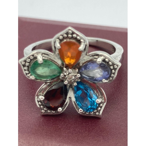 202 - Stunning Multi gemstone SILVER RING Having Garnet, Aqua ,Tanzanite etc  set in floral formation with... 