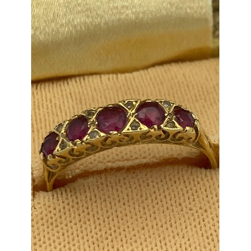 84 - Beautiful 18 carat GOLD and RUBY RING having 5 RUBIES set to top separated with Diamond detail. Full... 