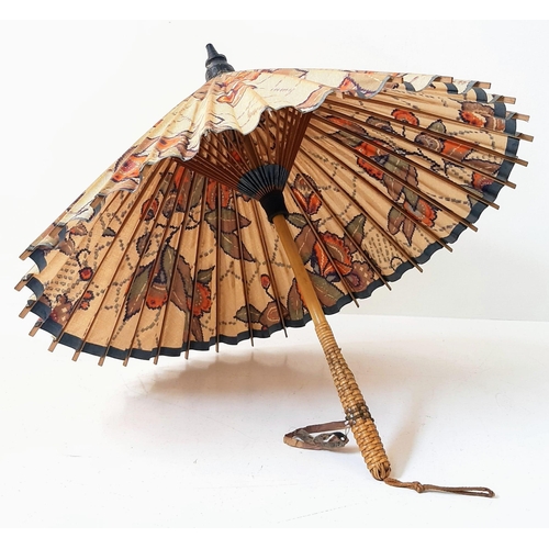 1161 - An Antique Ladies Japanese Parasol, Floral Print. 55cm In Length. a/f