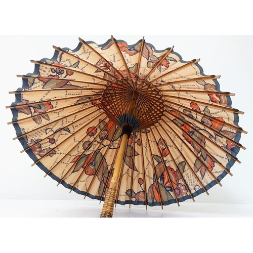 1161 - An Antique Ladies Japanese Parasol, Floral Print. 55cm In Length. a/f