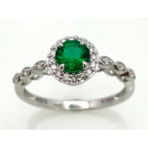 438 - 9K WHITE GOLD DIAMOND AND GREENT STONE RING. Total Weight 2G.  0.10CT Diamond. SIZE N