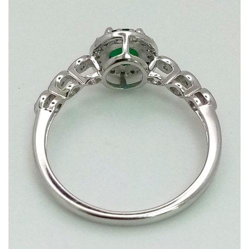 438 - 9K WHITE GOLD DIAMOND AND GREENT STONE RING. Total Weight 2G.  0.10CT Diamond. SIZE N