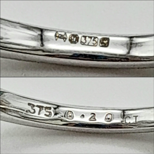 645 - 9K WHITE GOLD DIAMOND TWIST BAND RING. 0.20CT DIAMOND. TOTAL WEIGHT 2.1G. SIZE N
