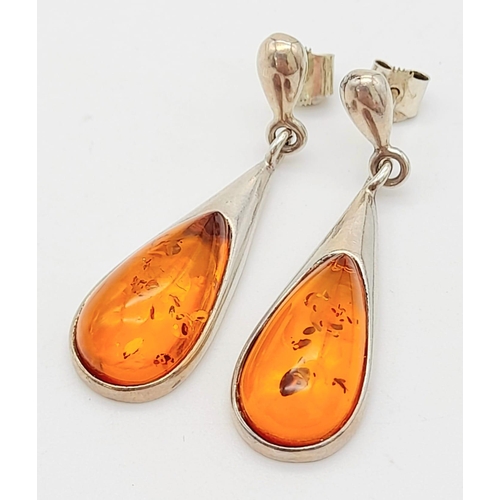 744 - A Pair Of White Metal (Possibly Silver) and Amber Earrings. Total Weigh 4.92g