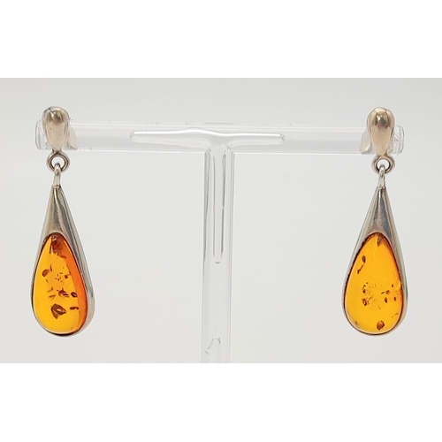 744 - A Pair Of White Metal (Possibly Silver) and Amber Earrings. Total Weigh 4.92g
