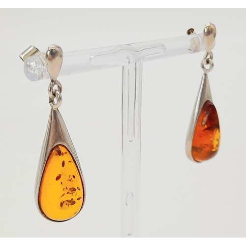 744 - A Pair Of White Metal (Possibly Silver) and Amber Earrings. Total Weigh 4.92g