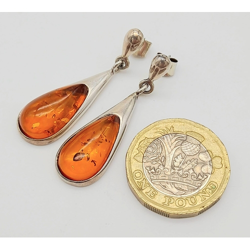 744 - A Pair Of White Metal (Possibly Silver) and Amber Earrings. Total Weigh 4.92g
