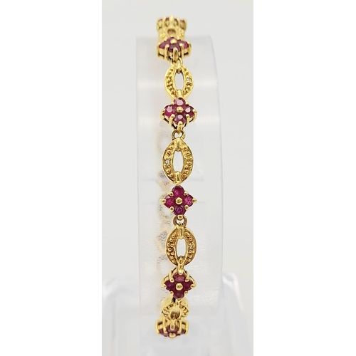 30 - 18K YELLOW GOLD RUBY SET BRACELET. TOTAL WEIGHT 11.26G