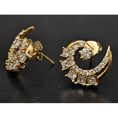 68 - 18K YELLOW GOLD DIAMOND SET SWIRL STUD EARRINGS. 0.90CT DIAMONDS. TOTAL WEIGHT 4.09G