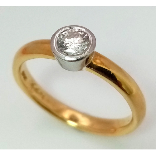 1620 - AN 18K GOLD SOLITAIRE DIAMOND RING .  4.2gms   size N   .33ct