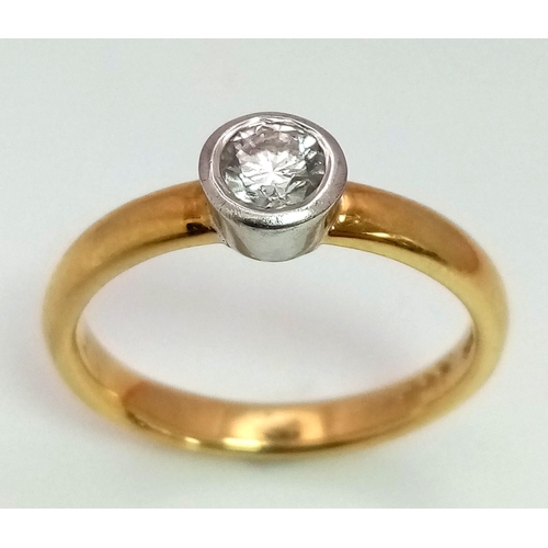 1620 - AN 18K GOLD SOLITAIRE DIAMOND RING .  4.2gms   size N   .33ct