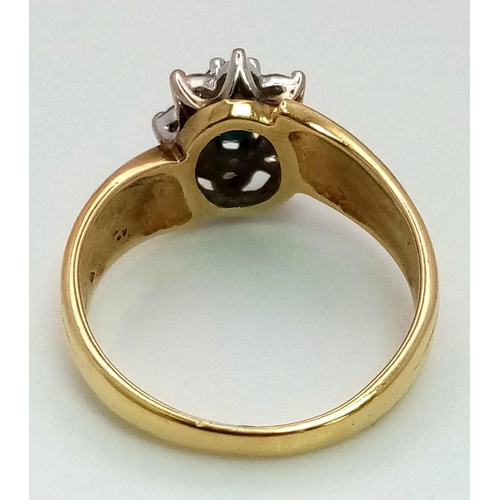 1626 - A DESIGNER 18K GOLD RING WITH CENTRAL SAPPHIRE SURRONDED BY A HALO OF DIAMONDS .  5.5gms   size O