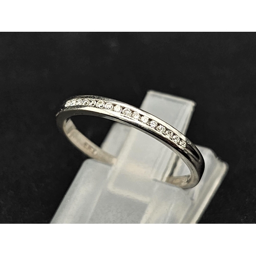 470 - 18k white gold channel set diamond half eternity ring (dia:0.20ct) 1.76g, size M