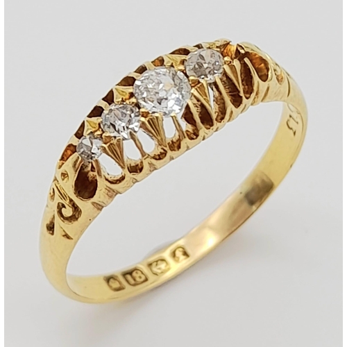 637 - A Vintage 18K Yellow Gold Diamond Ring. Four bright, white round cut diamonds (unfortunately one is ... 