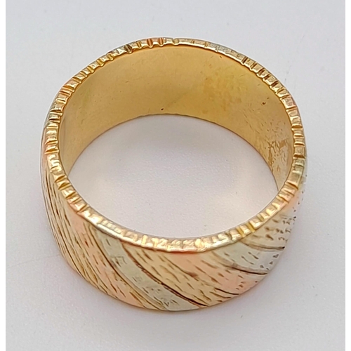 9 - A 9K Tri-Colour Gold Band Ring. Diagonal waves of yellow, white and rose gold. Size Q. 10.21g