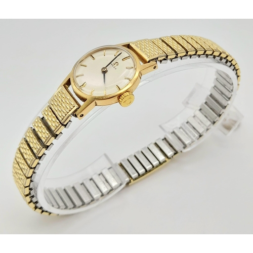 11 - A Vintage 1969 Omega 9K Gold Ladies Watch. Expandable gold-plated bracelet. 9k gold case - 20mm. Whi... 