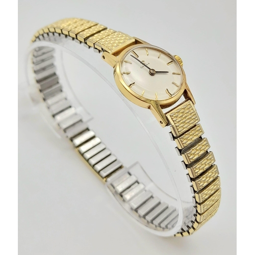 11 - A Vintage 1969 Omega 9K Gold Ladies Watch. Expandable gold-plated bracelet. 9k gold case - 20mm. Whi... 