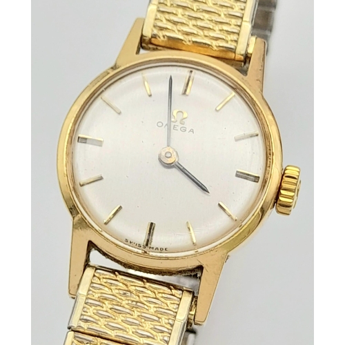 11 - A Vintage 1969 Omega 9K Gold Ladies Watch. Expandable gold-plated bracelet. 9k gold case - 20mm. Whi... 