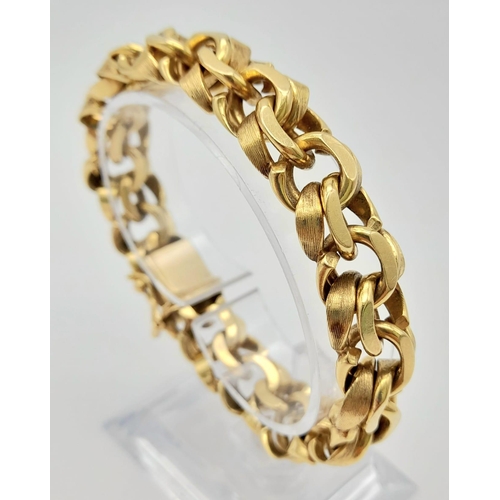 2 - A Solid 14K Yellow Gold Intricate Linked Statement Gents Bracelet. 20cm. 74.91g.