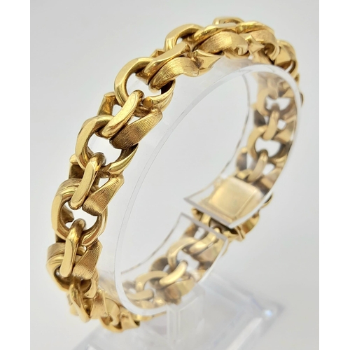 2 - A Solid 14K Yellow Gold Intricate Linked Statement Gents Bracelet. 20cm. 74.91g.