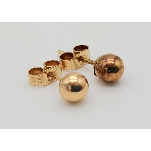 606 - Two Pairs of 9K Gold (yellow and rose) Stud Earrings. 1.05g total weight.