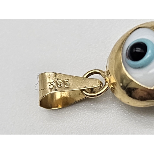 736 - 14K YELLOW GOLD EVIL EYE PENDANT. TOTAL WEIGHT 0.7G