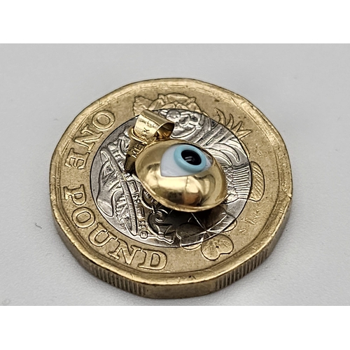 736 - 14K YELLOW GOLD EVIL EYE PENDANT. TOTAL WEIGHT 0.7G