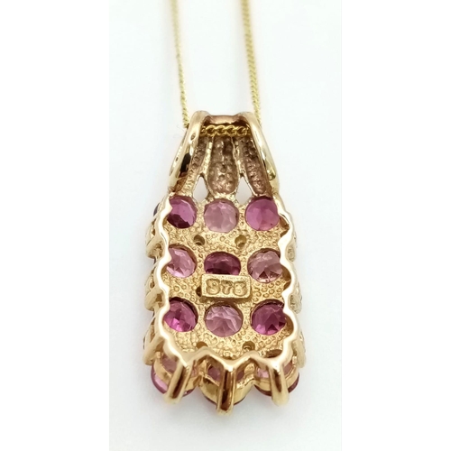 762 - A 9K GOLD AND AMETHYSR PENDANT ON A 9K GOLD DISAPPEARING 42cms NECKLACE 3gms