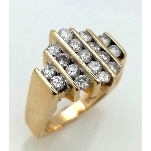 769 - A 14K GOLD AND DIAMOND RING WITH 17 SMALL DIAMONDS SET VERTICALLY IN A MODERN DESIGN .  8.6gms   siz... 