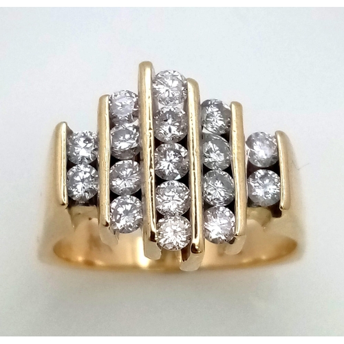 769 - A 14K GOLD AND DIAMOND RING WITH 17 SMALL DIAMONDS SET VERTICALLY IN A MODERN DESIGN .  8.6gms   siz... 