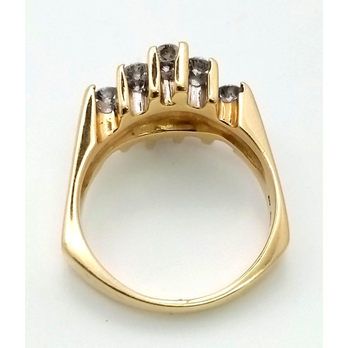 769 - A 14K GOLD AND DIAMOND RING WITH 17 SMALL DIAMONDS SET VERTICALLY IN A MODERN DESIGN .  8.6gms   siz... 