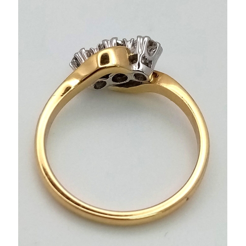 776 - AN 18K GOLD DIAMOND TRILOGY RING IN CROSS OVER STYLE WITH 0.8ct OF QUALITY DIAMONDS .   3.9gms   siz... 