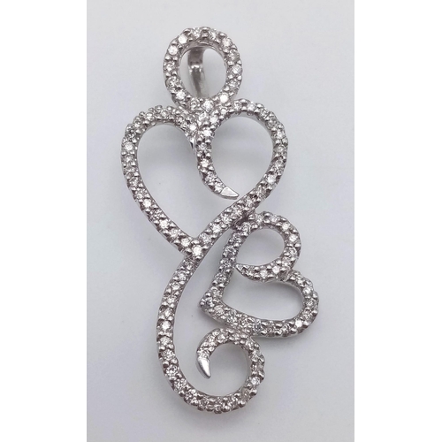 925 - A DESIGNER HEAVY WHITE GOLD DIAMOND PENDANT .  5.9gms   3.8cms drop