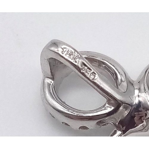 925 - A DESIGNER HEAVY WHITE GOLD DIAMOND PENDANT .  5.9gms   3.8cms drop