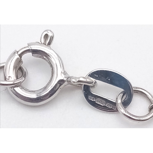 912 - A 9K WHITE GOLD AND DIAMOND PENDANT AND MATCHING EARRING SET .4.5gms