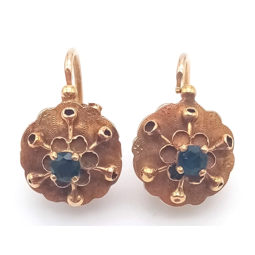919 - A PAIR OF 18K ROSE GOLD EARRINGS WITH SAPPHIRE CENTRE STONES .2.2gms
