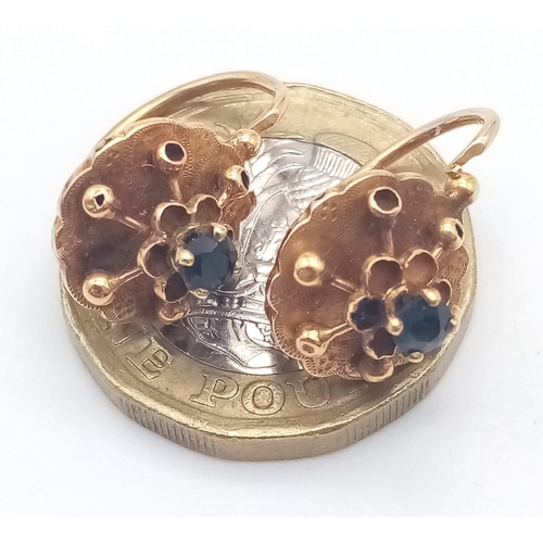 919 - A PAIR OF 18K ROSE GOLD EARRINGS WITH SAPPHIRE CENTRE STONES .2.2gms