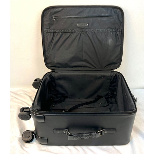 40 - A Bottega Veneta Black Intrecciato Leather Trolley Case. Large exterior pocket. Generous, deep inter... 