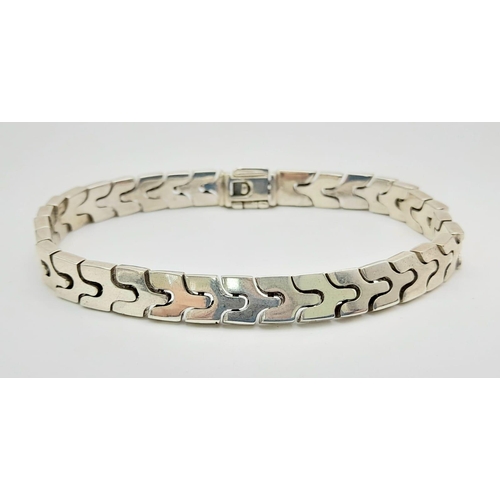 612 - A Silver Link Bracelet. Total Weight 26.38g.    11148