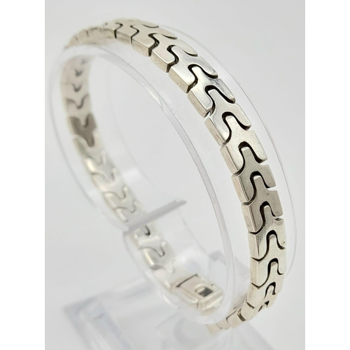 612 - A Silver Link Bracelet. Total Weight 26.38g.    11148