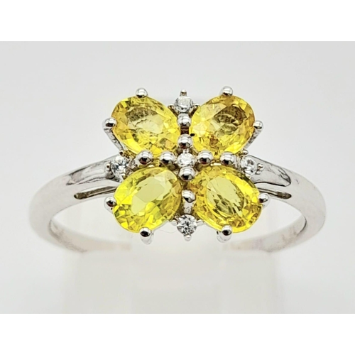 643 - A 9K WHITE GOLD YELLOW SAPPHIRE RING ADORNED WITH WHITE ZIRCONIA , COMES WITH CERTIFICATE OF AUTHENT... 
