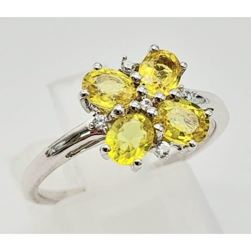 643 - A 9K WHITE GOLD YELLOW SAPPHIRE RING ADORNED WITH WHITE ZIRCONIA , COMES WITH CERTIFICATE OF AUTHENT... 