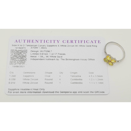 643 - A 9K WHITE GOLD YELLOW SAPPHIRE RING ADORNED WITH WHITE ZIRCONIA , COMES WITH CERTIFICATE OF AUTHENT... 